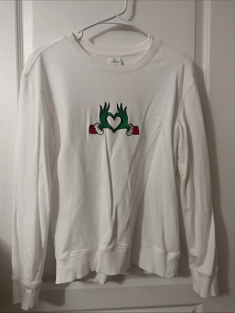 White Sweatshirt with Green Heart Hands Graphic